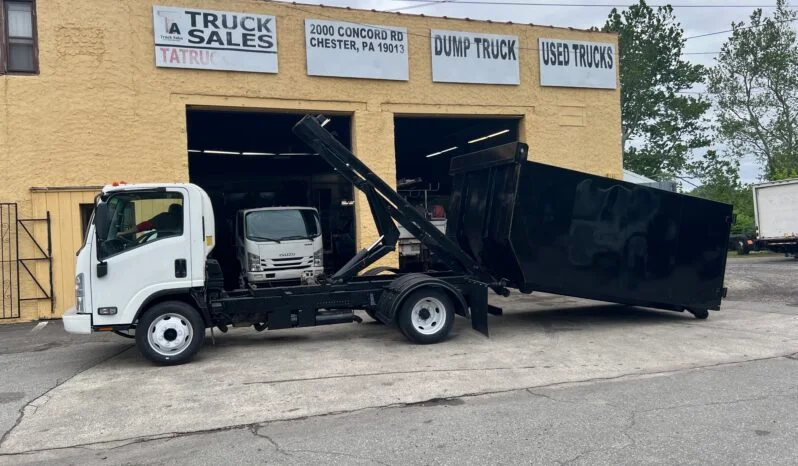 Image of a black dump truck