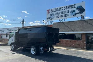 Image of a man welding truck parts